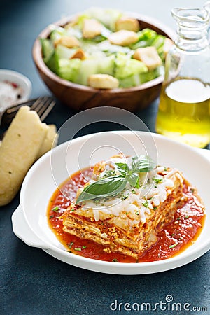 Traditional lasagna on white plate Stock Photo