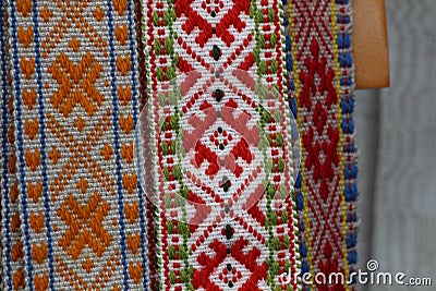 Traditional Latvian belts are belts are made with yarn, precious artefacts, variety of colors, different in Latvian regions. Stock Photo