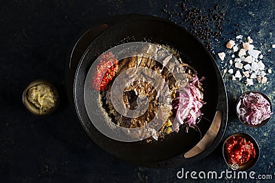 Traditional leaf liver with sauce and onions in a black pan, Yaprak Ci?er Stock Photo