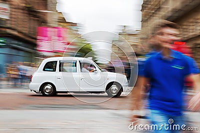 Traditional London Taxi Cab in motion blur Editorial Stock Photo