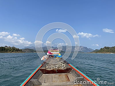 Traditional long tail boat front view on Cheow Lan lake in Thailand Stock Photo