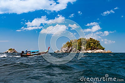 Traditional Longtail boat bring tourists to visit island around Editorial Stock Photo