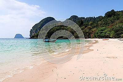 Traditional longtailboat on a beach in thailand Stock Photo