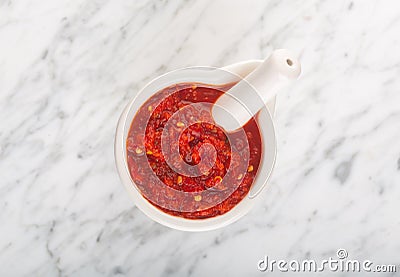 Traditional Maghrebi hot chili pepper sauce paste harissa or adjika. Tunisia and Arabic. Top view Stock Photo