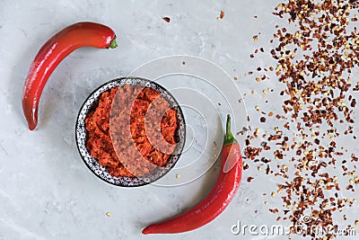 Traditional Maghrebi hot chili pepper sauce paste harissa. Marocco and arabic cuisine. Georgian adjika. Italian peperoncino sause Stock Photo
