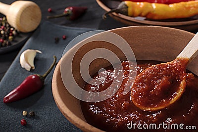 Traditional Maghrebi hot chili pepper sauce paste harissa. Tunisia and Arabic cuisine adjika Stock Photo