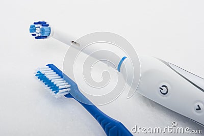 Traditional Manual and Electric Toothbrush Stock Photo