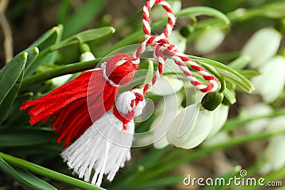 Traditional martisor and fresh snowdrop flowers outdoors, closeup Stock Photo