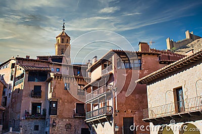 Traditional medieval architecture in the main square of Albarracin, Teruel. Bell tower of the parish of Santa Maria and Santiago, Stock Photo