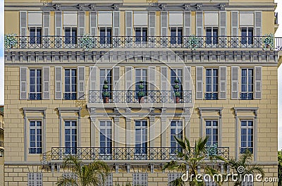 Traditional Mediterranean facade of a bourgeois building with illusion paint work in Nice, South of France Stock Photo