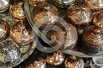 Copper and silver sugar pots. Eastern authentic oriental cups. Stock Photo