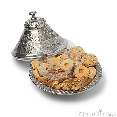 Traditional metal tajine with homemade Moroccan cookies Stock Photo