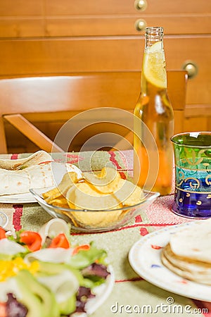 Traditional mexican food with a bowl of nachos, a plate of chick Stock Photo