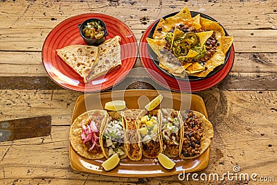 Traditional Mexican food combo with a tasting of assorted tacos, Stock Photo