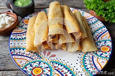 Mexican fried tacos also called Flautas Stock Photo