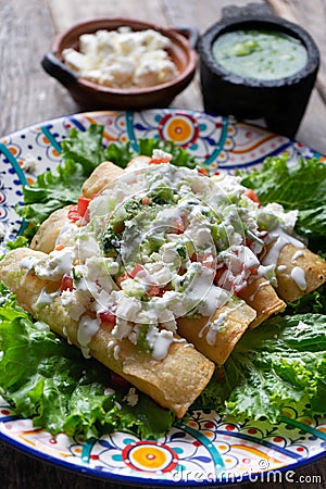 Mexican fried tacos also called Flautas Stock Photo