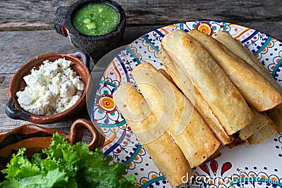 Mexican fried tacos also called Flautas Stock Photo