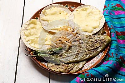 Mexican grilled nopal cactus with quesadillas and serrano chili peppers on white background Stock Photo