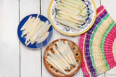 Mexican jicama and cucumber cutted on white background Stock Photo