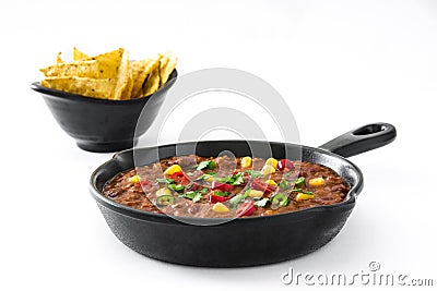 Traditional mexican tex mex chili con carne in a frying pan isolated Stock Photo