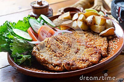 Traditional milanese beef and french fries Stock Photo