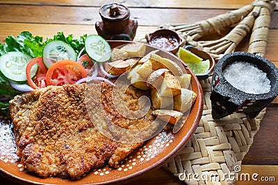 Traditional milanese beef and french fries Stock Photo