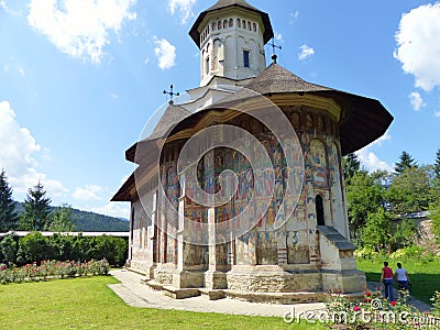 Traditional monastery with painting walls of Bucovina in Romania. Editorial Stock Photo