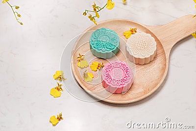 Traditional mooncakes on table setting. Snowy skin mooncakes. Ch Stock Photo