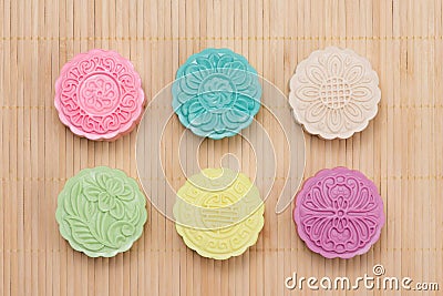 Traditional mooncakes on table setting. Snowy skin mooncakes. Ch Stock Photo