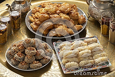 Traditional Moroccan table with plates patisserie cookies and tea Stock Photo