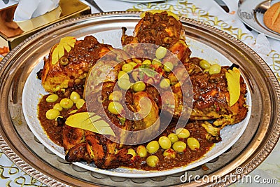 Traditional moroccan tajine with chicken,pototoes and olives close up. Stock Photo