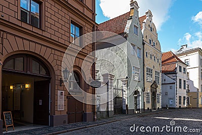 Traditional narrow street in old town of Riga city, Latvia Editorial Stock Photo