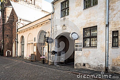 Traditional narrow street in old town of Riga city, Latvia Editorial Stock Photo