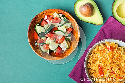 Traditional National Mexican Tomato Rice Stewed Pilaf with Hot Chili Peppers Garlic in Bowl. Fresh Cucumber Onion Salsa Avocado Stock Photo