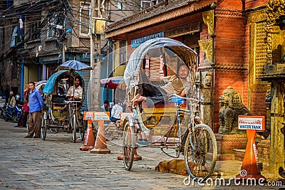 Traditional nepalese rickshaw parked on the street, Kathmandu, Nepal Editorial Stock Photo