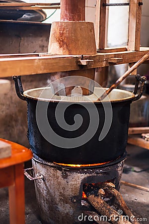 Traditional noodles in making on a vintage machine Stock Photo