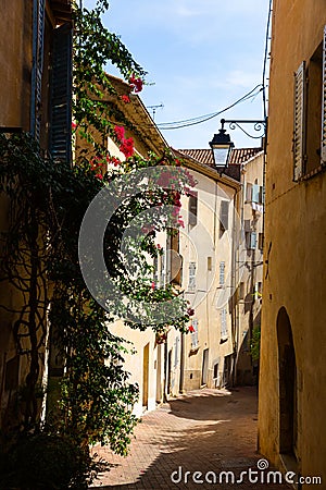 Traditional old houses on narrow winding streets in french town of Hyeres in autumn Stock Photo