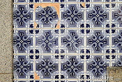 Traditional old tiles wall on the street Portuguese painted tin-glazed, azulejos ceramic. Porto Stock Photo