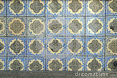 Traditional old tiles wall on the street Portuguese painted tin-glazed, azulejos ceramic tilework. Stock Photo