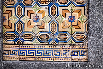 Traditional old tiles wall on the street Portuguese painted tin-glazed, azulejos ceramic tilework. Stock Photo