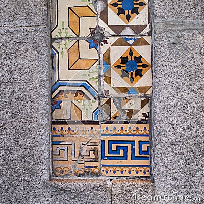 Traditional old tiles wall on the street Portuguese painted tin-glazed, azulejos ceramic tilework. Stock Photo