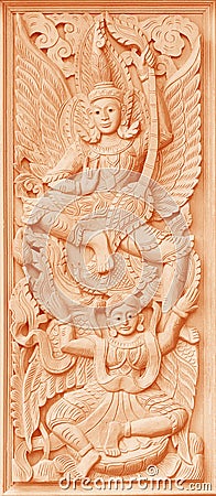 Traditional Old wood carving on the wall of Temple in Thailand, Stock Photo