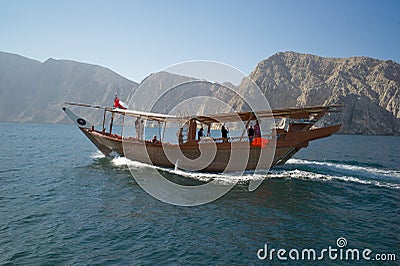 A traditional Omani dhow cruising across sea. Editorial Stock Photo