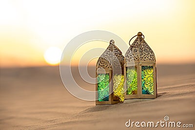 Traditional ornamental arabic candle in desert. Stock Photo