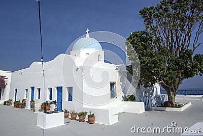 Traditional Orthodox blue dome church in Greece on a sunny summer day, with the typical blue and white colours. Santorini, Editorial Stock Photo