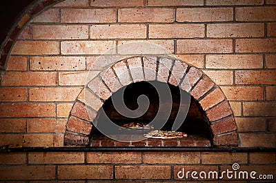 Traditional oven for cooking and baking pizza. Stock Photo