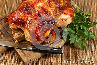 Traditional Oven Roasted Chicken on Wooden Serving Board Stock Photo