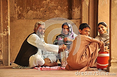 Traditional Pakistani family eating Editorial Stock Photo