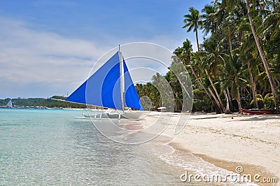 Traditional paraw sailing boat on white beach Stock Photo