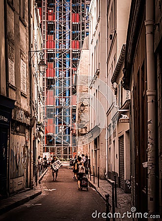 A traditional Parisian back street with the post-modern pipes and vents of Centre Pompidou Editorial Stock Photo